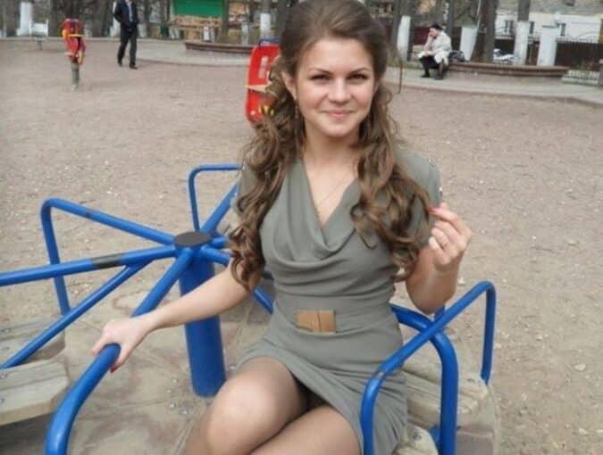 a photoshot under curly brunettes dress
