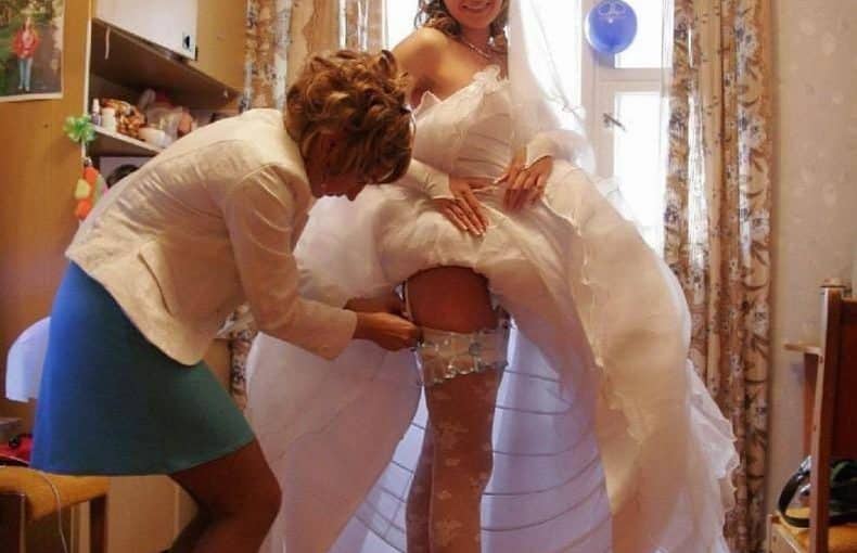 the brides skirt is pulled up