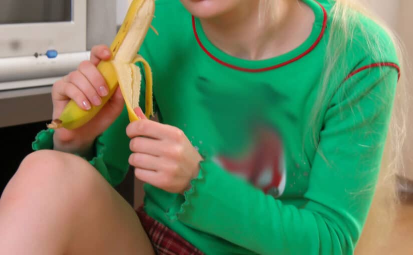 Blonde Teen Flashing Playfully While Eating Banana